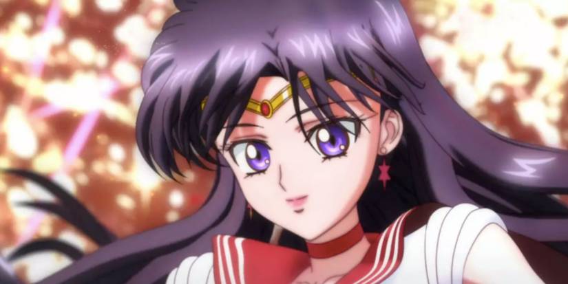 a black haired sailor guardian looks at the camera