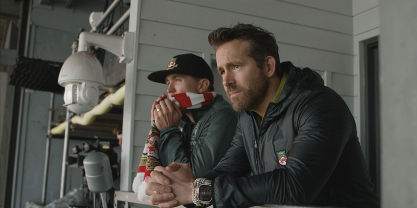 Ryan Reynolds and Rob McElhenney looking out from Wrexham stands