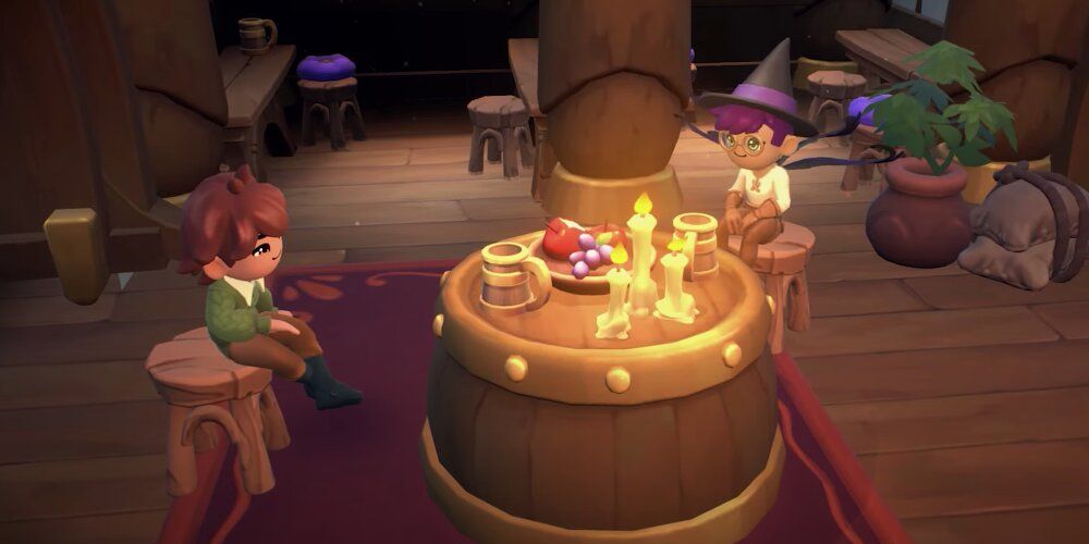 Argyle y el jugador sentados junto a un barril iluminado con velas