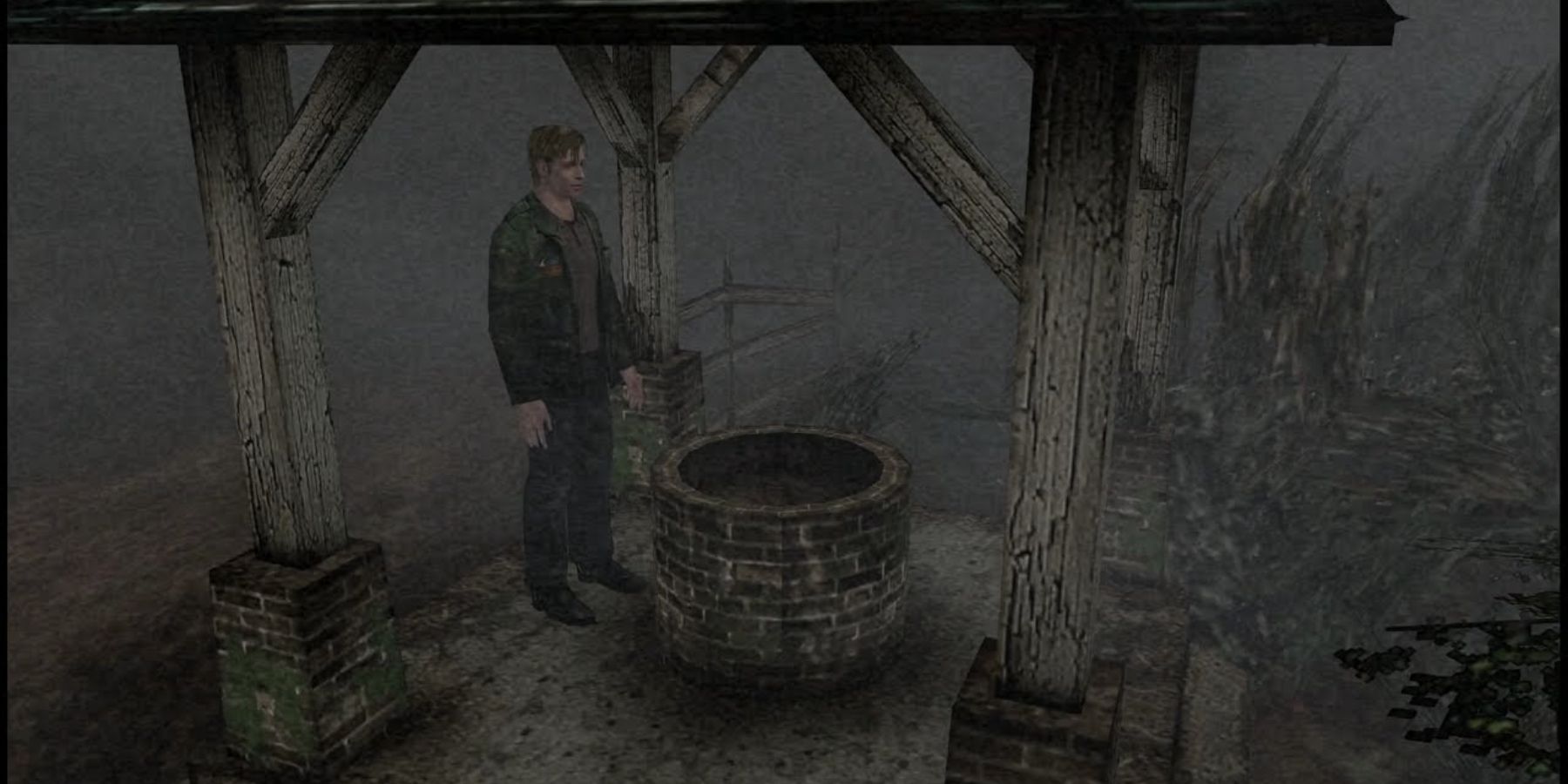 James investigating an old well in Silent Hill 2