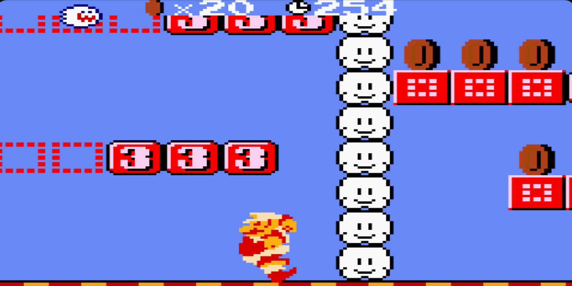 A Fire Flower-powered Mario below '3' boxes and near some clouds, coins and translucent boxes are nearby