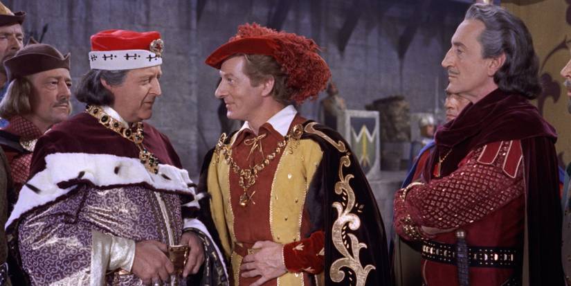 Hawkins speaks to the King with Ravenhurst behind him