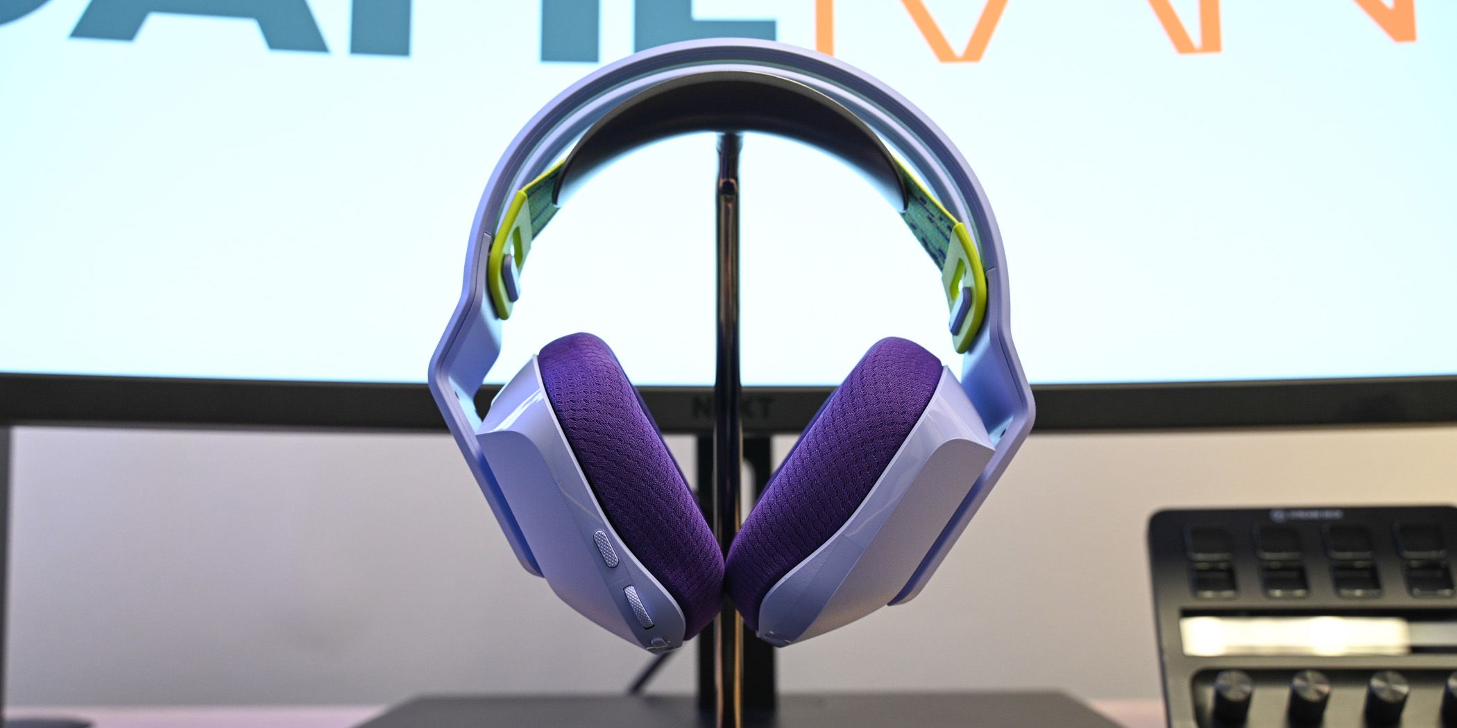 The Logitech G733 headset without the mic plugged in on a headphone stand