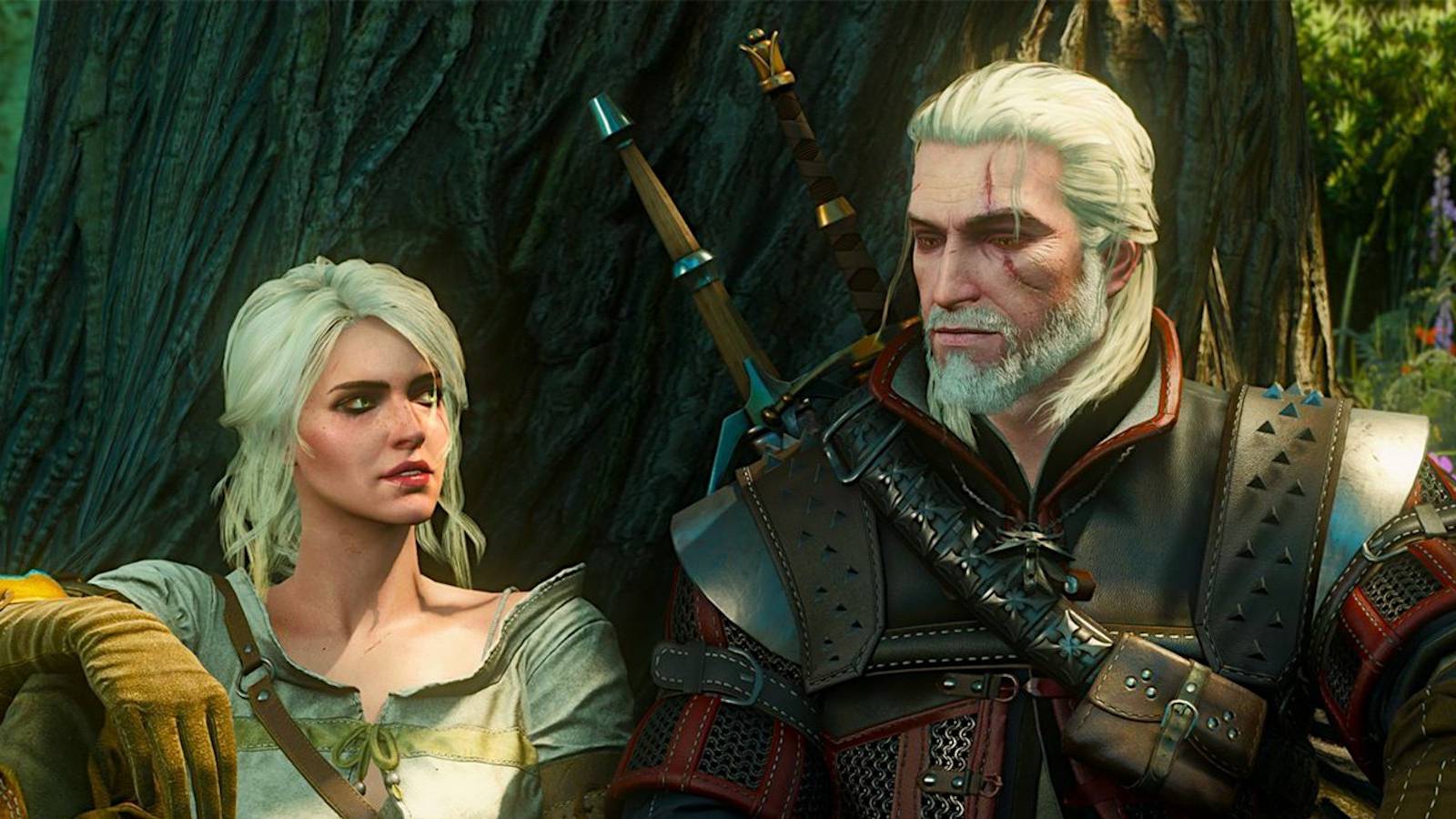 Siri and Gerald sitting by a tree