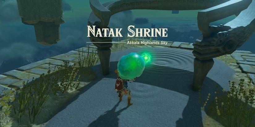 Tears of the Kingdom's Link holding a large green crystal outside of Natak Shrine