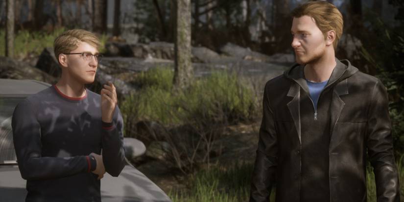 Protagonist Sam Higgs listens to a man wearing glasses in front of a car in a forested area