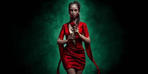 Emem from Swansong, holding a rose. 