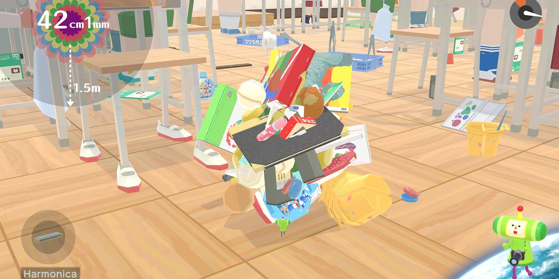 The prince rolling up various objects inside a classroom in We Love Katamari Reroll