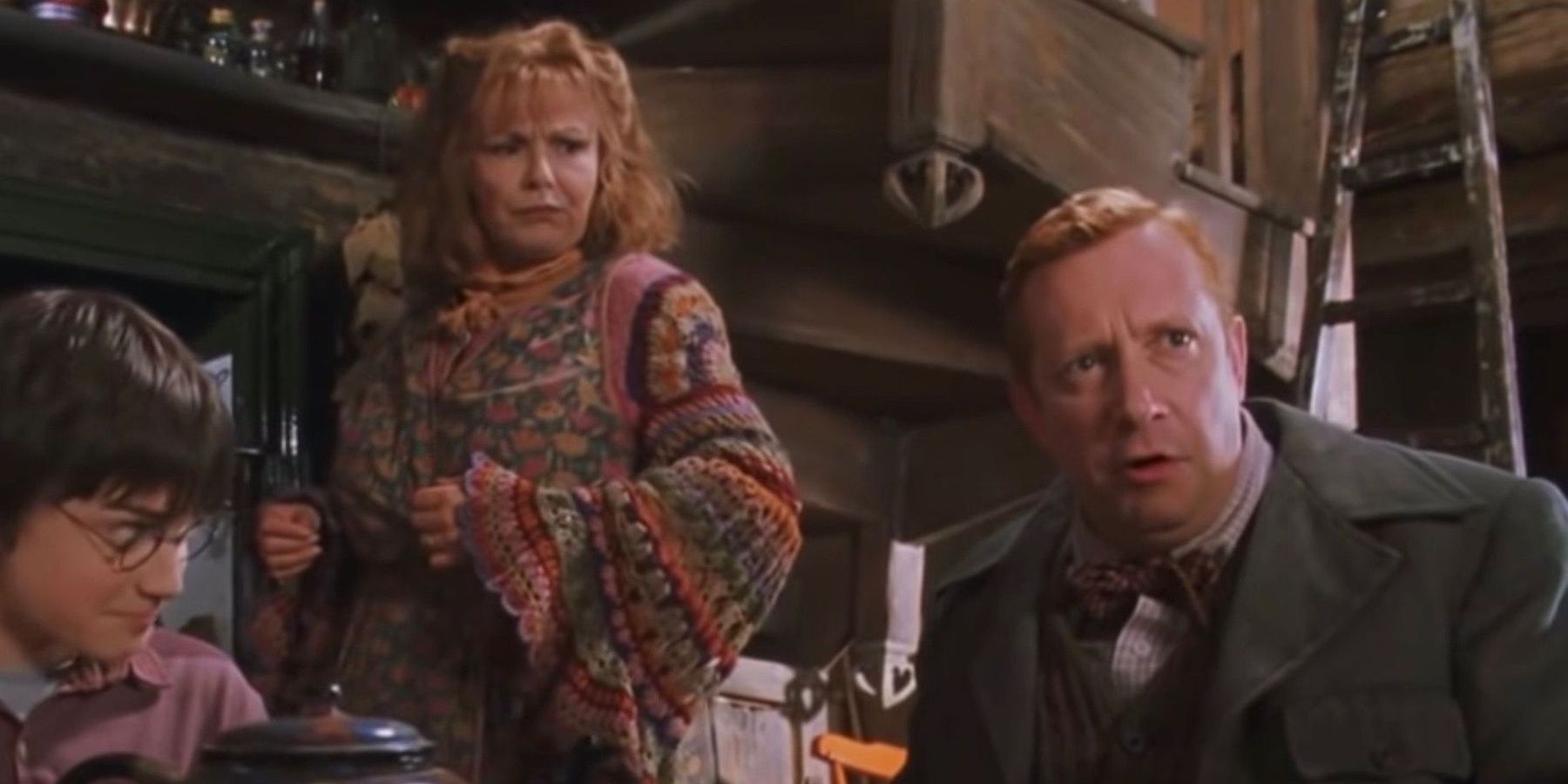 Harry and Molly look at Arthur Weasley