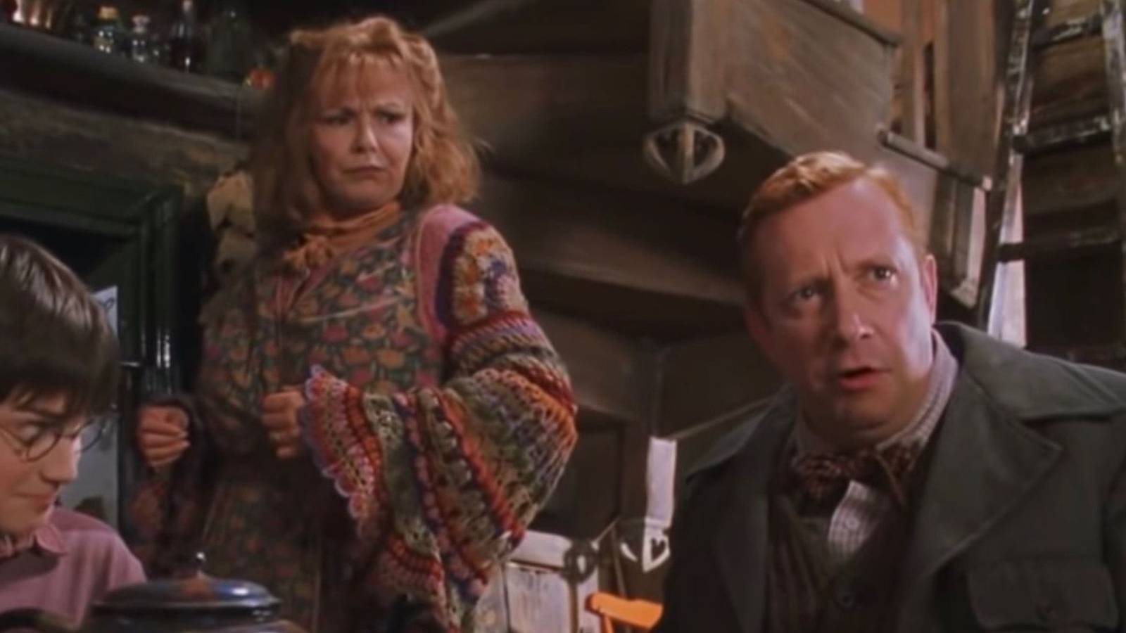 Harry and Molly look at Arthur Weasley