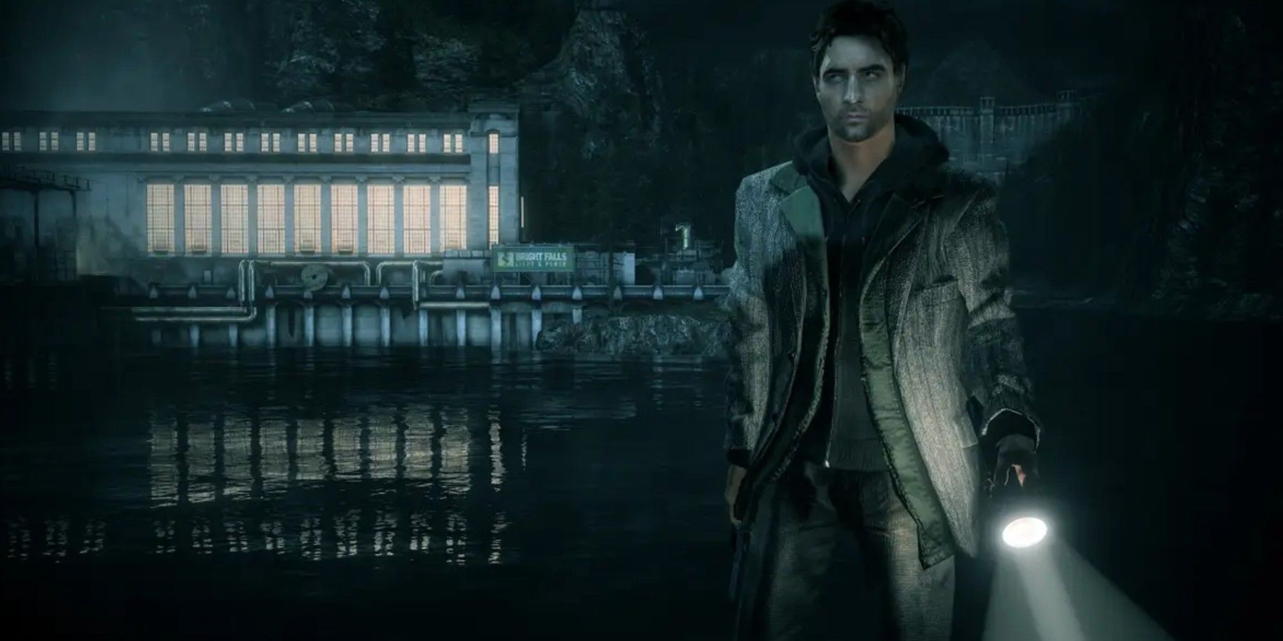 Alan Wake by a body of water with flashlight in hand