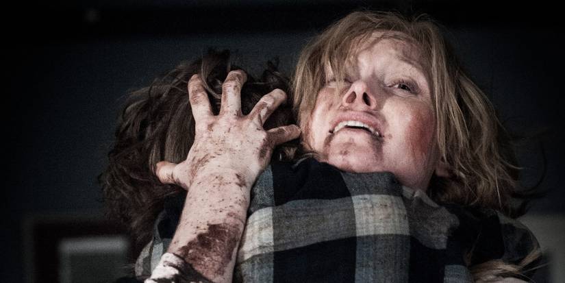 An image of a mother holding unto her child with fear