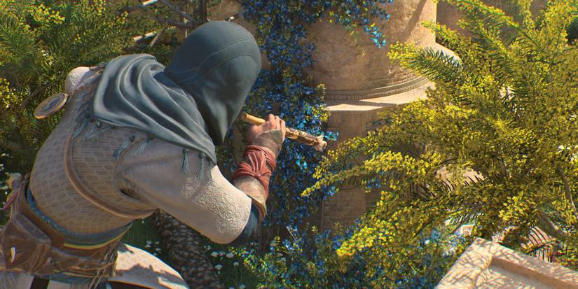 basim holding blowdart tool