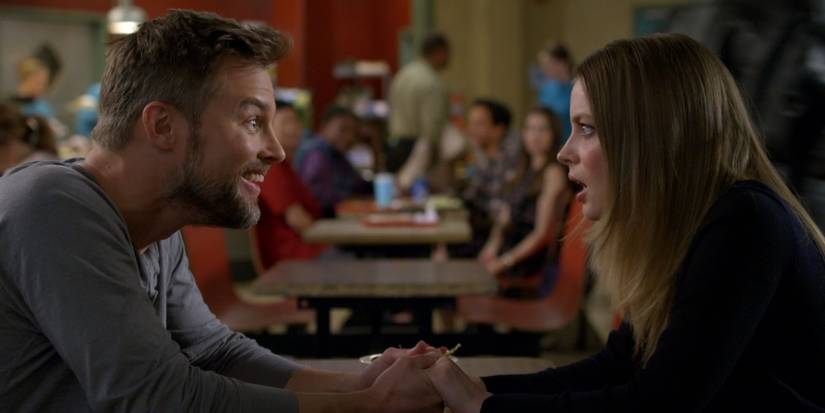 Rick and Britta holding hands