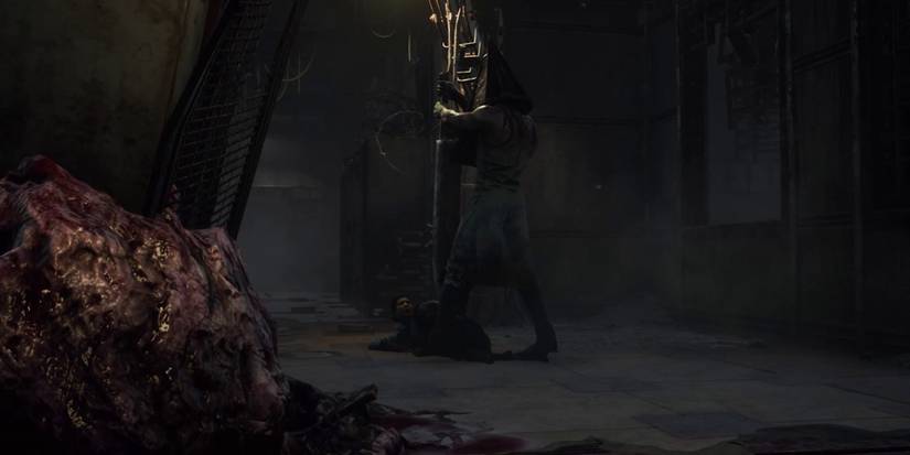 Pyramid head executioner sending survivor to cage of atonement