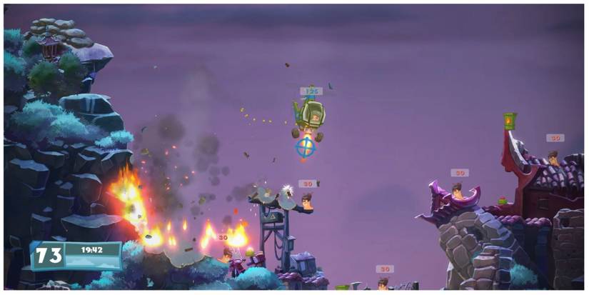 A Worms character flying over a gap in the map to attack the opposing team.
