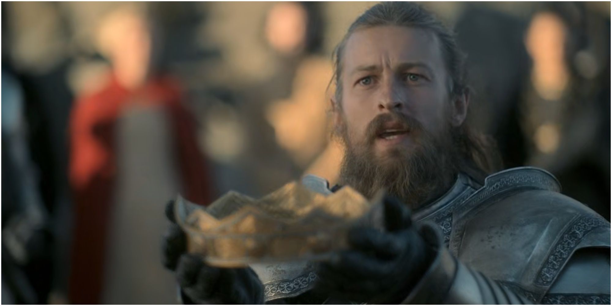 Ser Erryk Cargyll presents Viserys' crown to Rhaenyra in House of the Dragon.