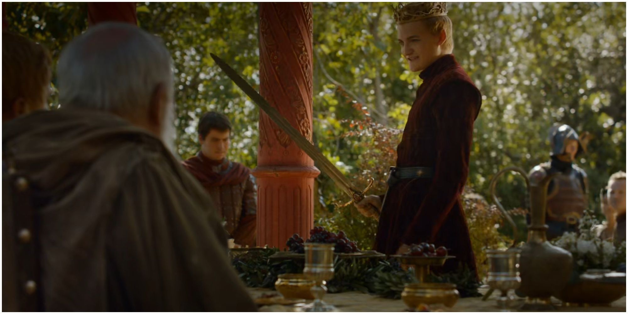 Joffrey Baratheon holding Widow's Wail in Game of Thrones.