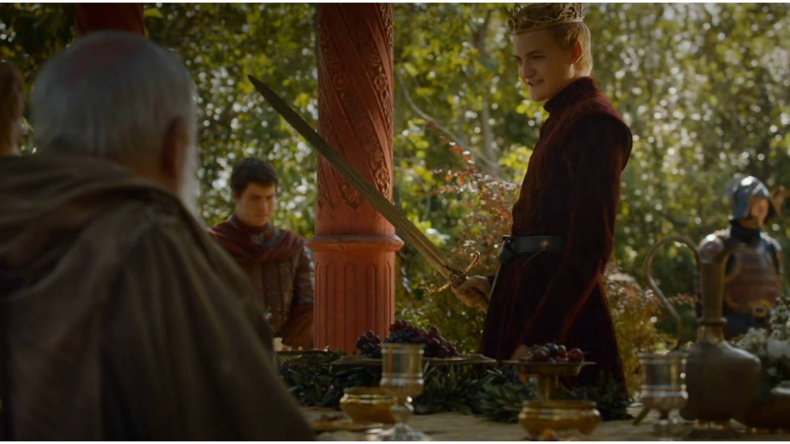 Joffrey Baratheon holding Widow's Wail in Game of Thrones.