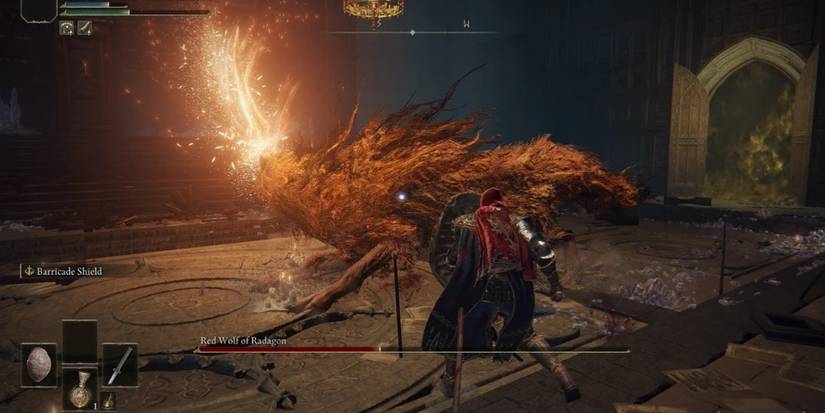 Red Wolf of Radagon about to swing a magical sword in Elden Ring
