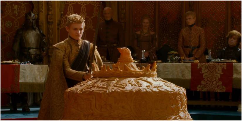 Joffrey cutting the pigeon pie open with Widow's Wail in Game of Thrones.