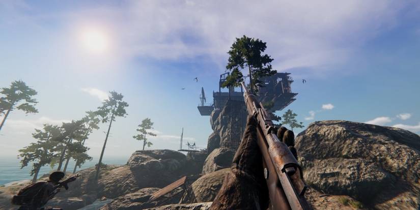 Holding a rifle while looking at an enemy settlement Sunkenland