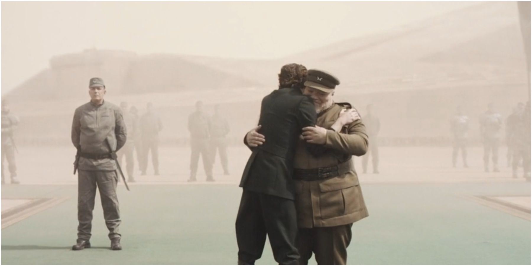 Paul Atreides hugs Thufir Hawat in Dune.