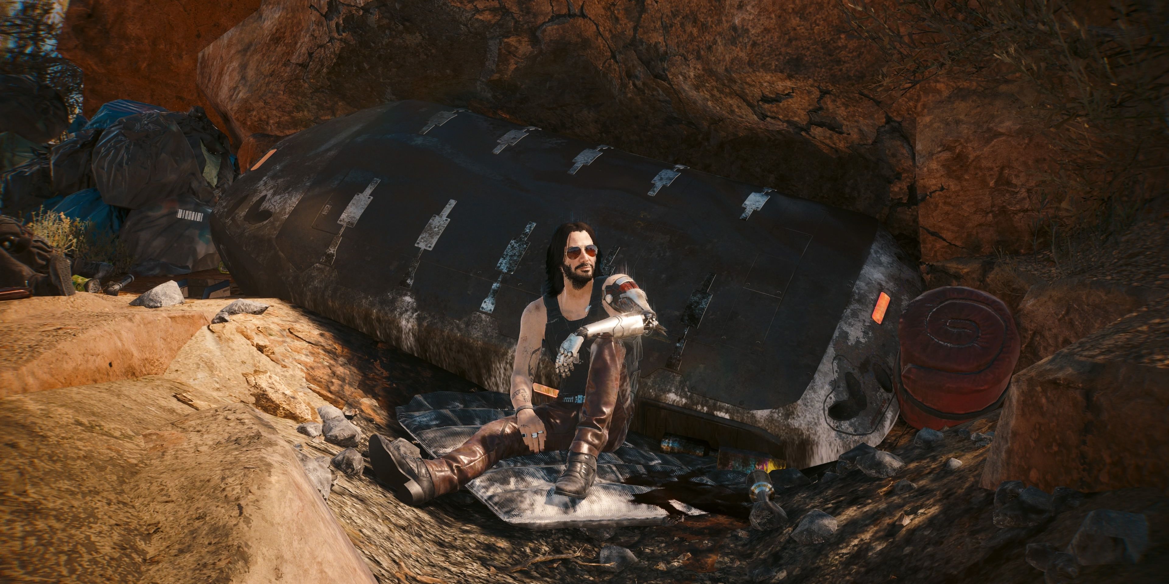 johnny silverhand sitting at songbird's crashed ship