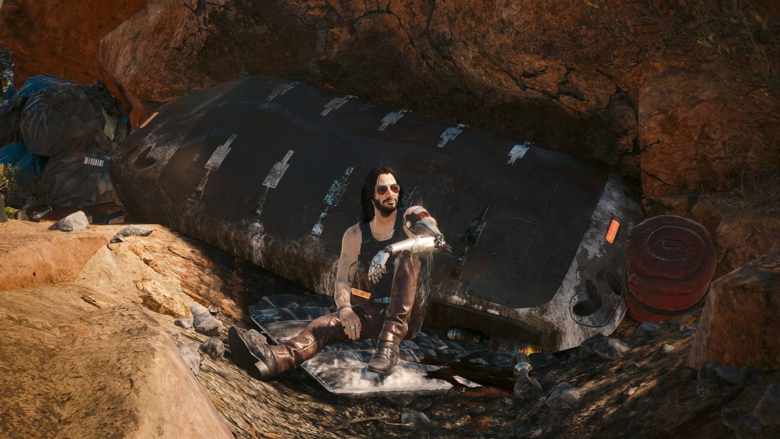 johnny silverhand sitting at songbird's crashed ship