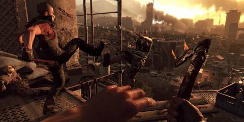 An individual wearing a mask kicking a zombie off a building in Dying Light