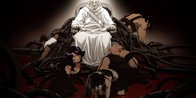 a man sits surrounded by people