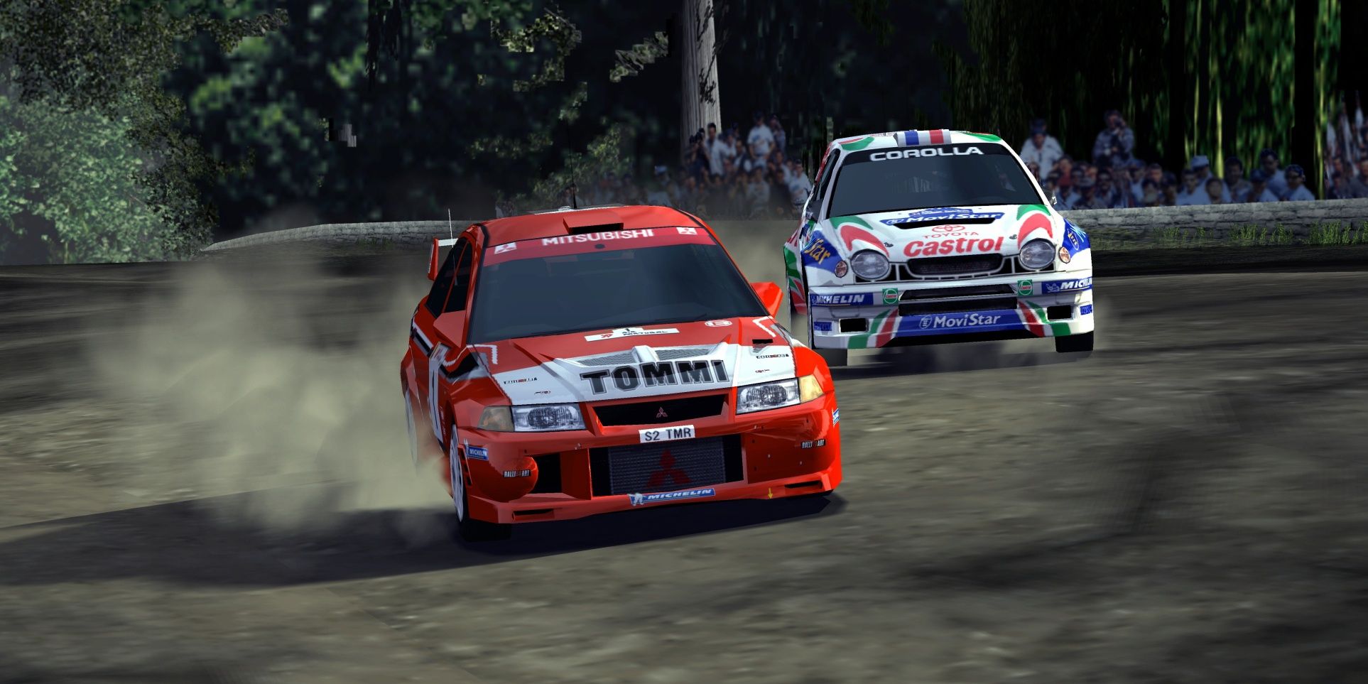 Two cars racing alongside each other with the words "Tommi" written on the red car and "Castrol" on the white car in Gran Turismo 3: A-Spec