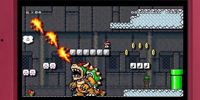 mario standing on a block above bowser in mario maker for 3ds