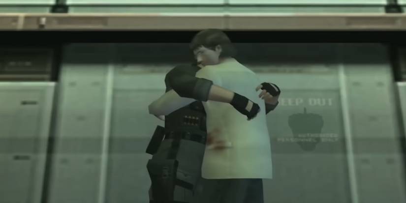 Snake and a blood-stained Otacon hugging near a metallic wall