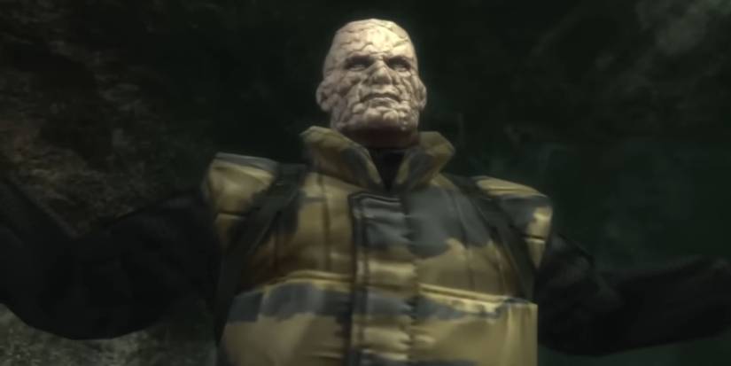 Unmasked version of The Pain covered in stings in a cave