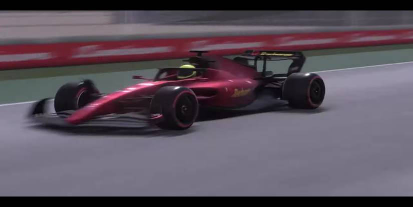 Player zooms across the track in a red car