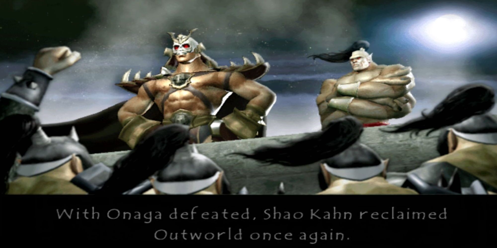 Shao Kahn beside Goro as Shokan warriors stand around