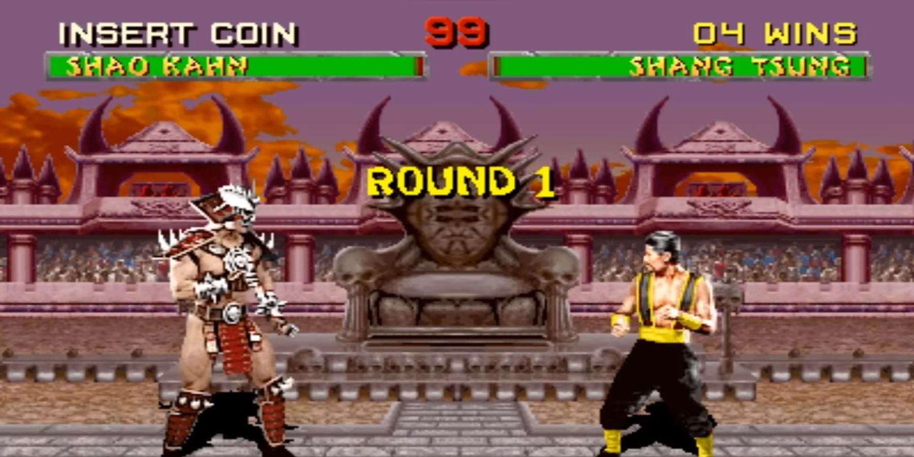 Shang Tsung Versus Shao Kahn in a colliseum, near a throne and while a crowd watches