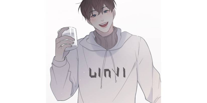 path to you a man holds a drink and smiles