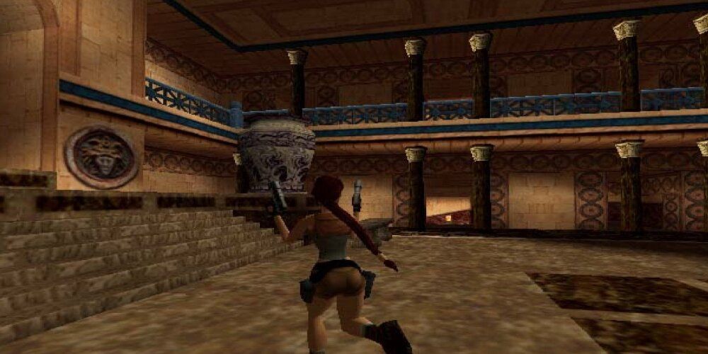 Lara Running Through A Mausoleum With Dual Pistols