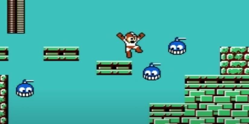 Mega Man Jumping Between Platforms With Blue Enemies