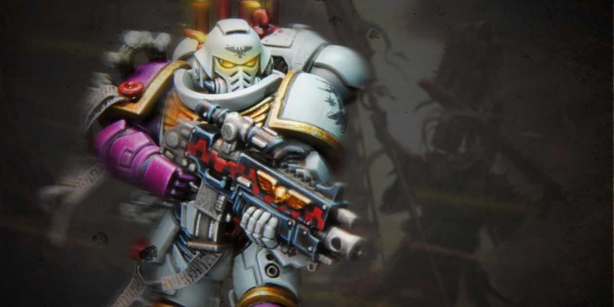 A Sons of the Phoenix Space Marine miniature holding a bolter with a motion blur effect on him
