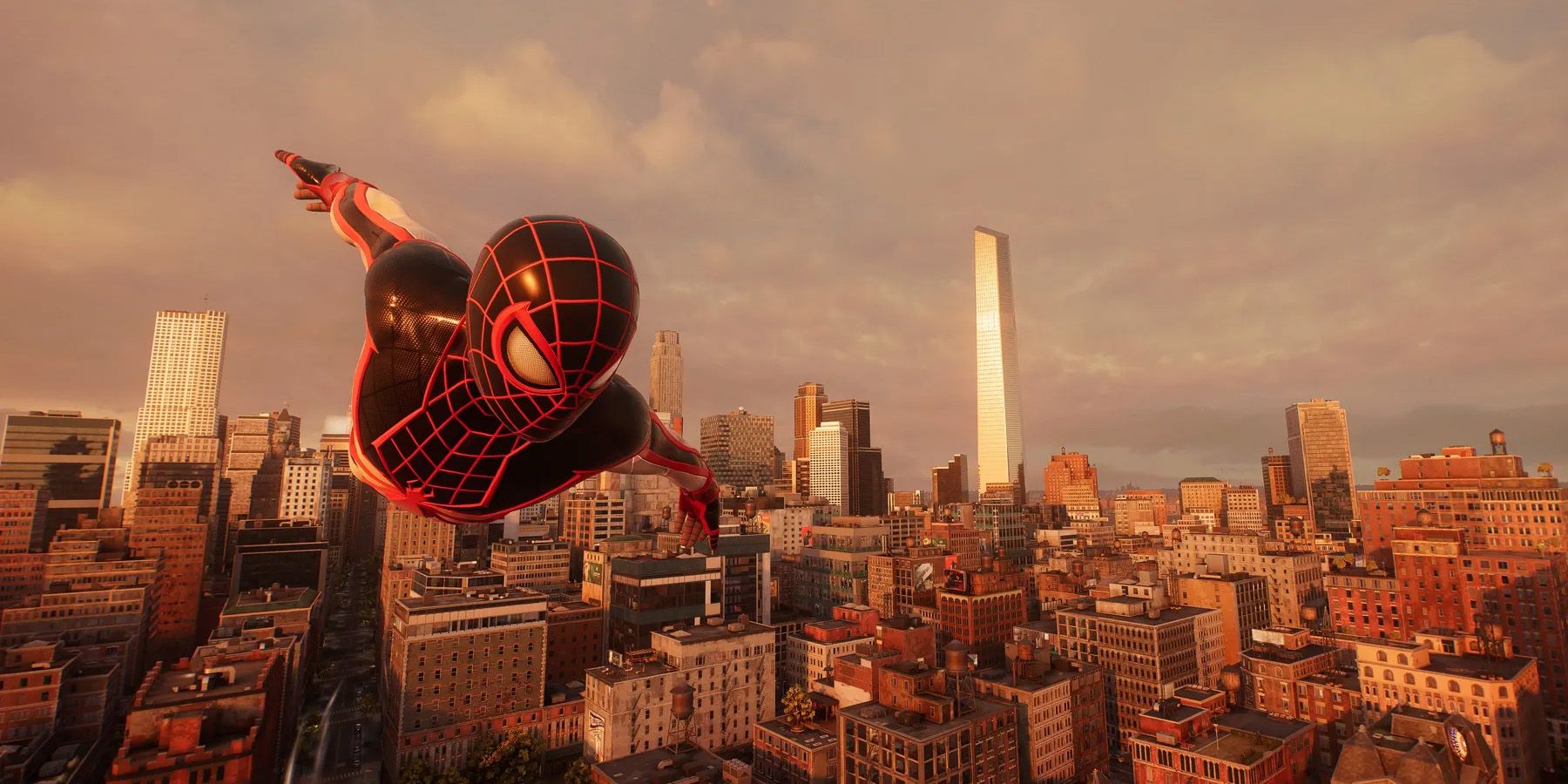 A screenshot of Miles Morales gliding above a sunset New York City in Marvel's Spider-Man 2.