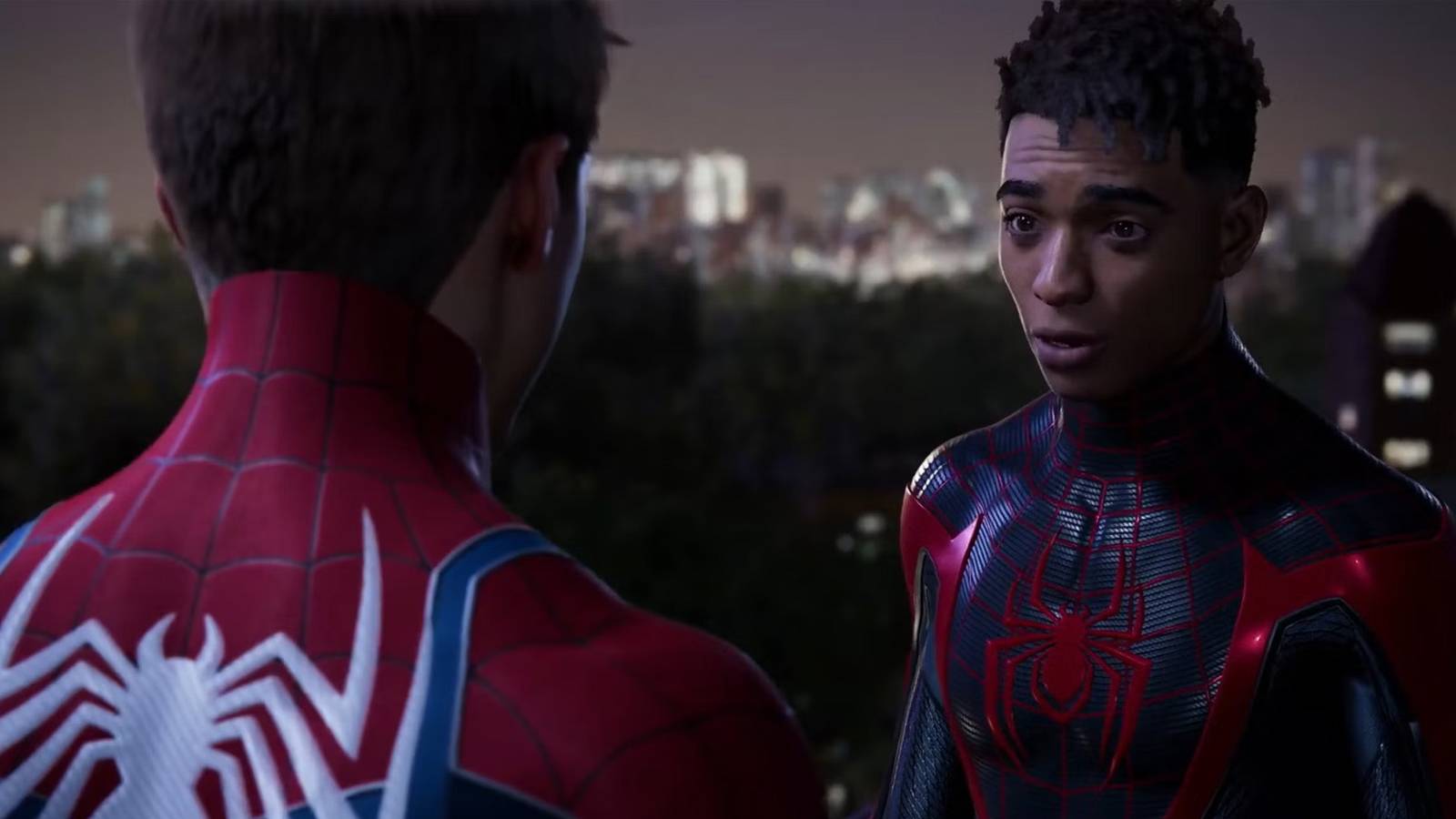A screenshot of Miles Morales and Peter Parker talking at night without thier masks on in Marvel's Spider-Man 2.