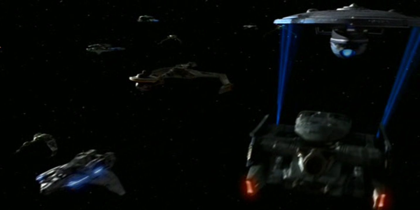 A Federation Tug pulls a damaged starship away from the Dominion War.