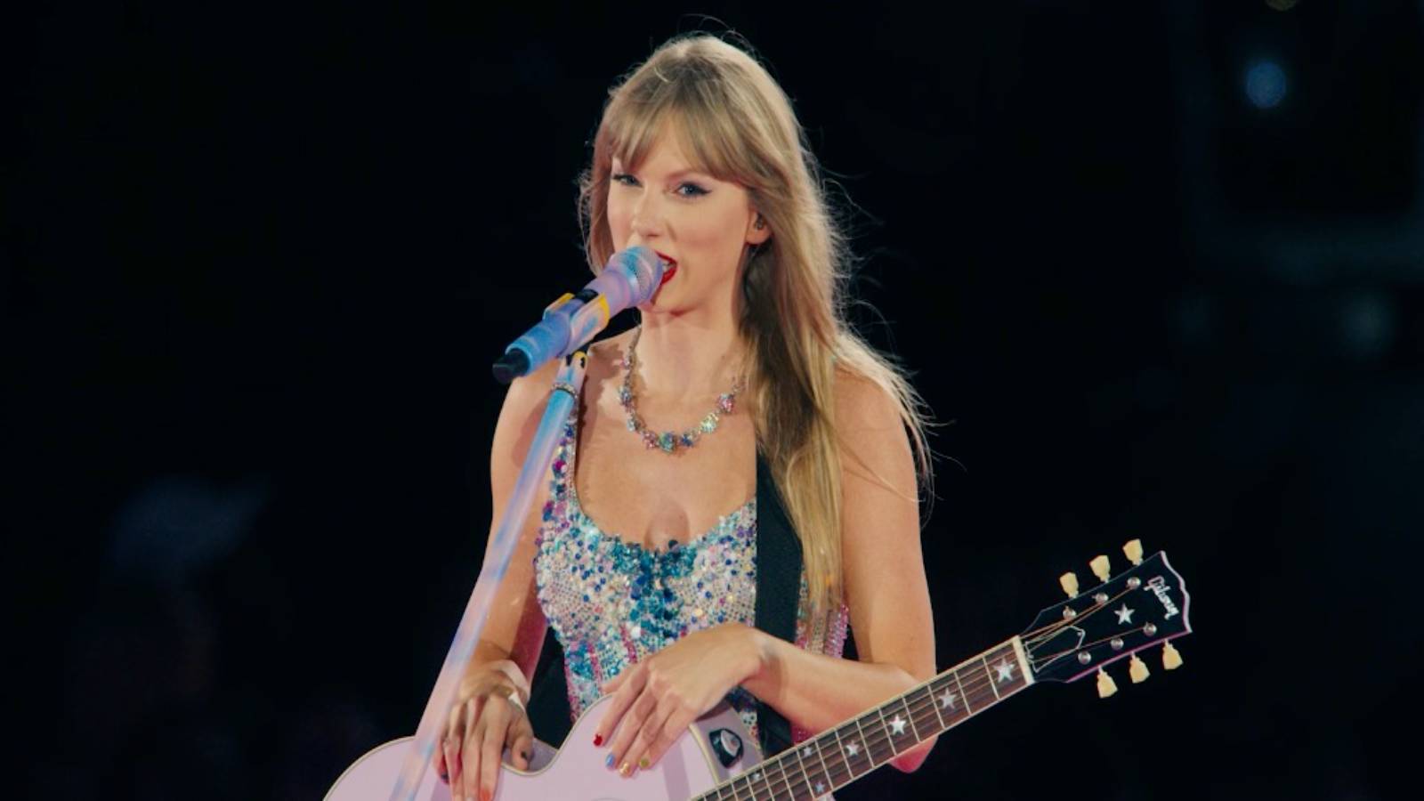taylor swift eras tour holding guitar
