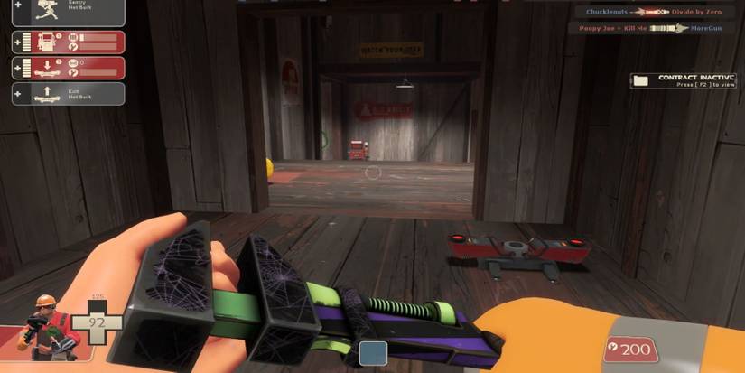 An Engineer looking at a teleporter and dispenser in a wooden corridor