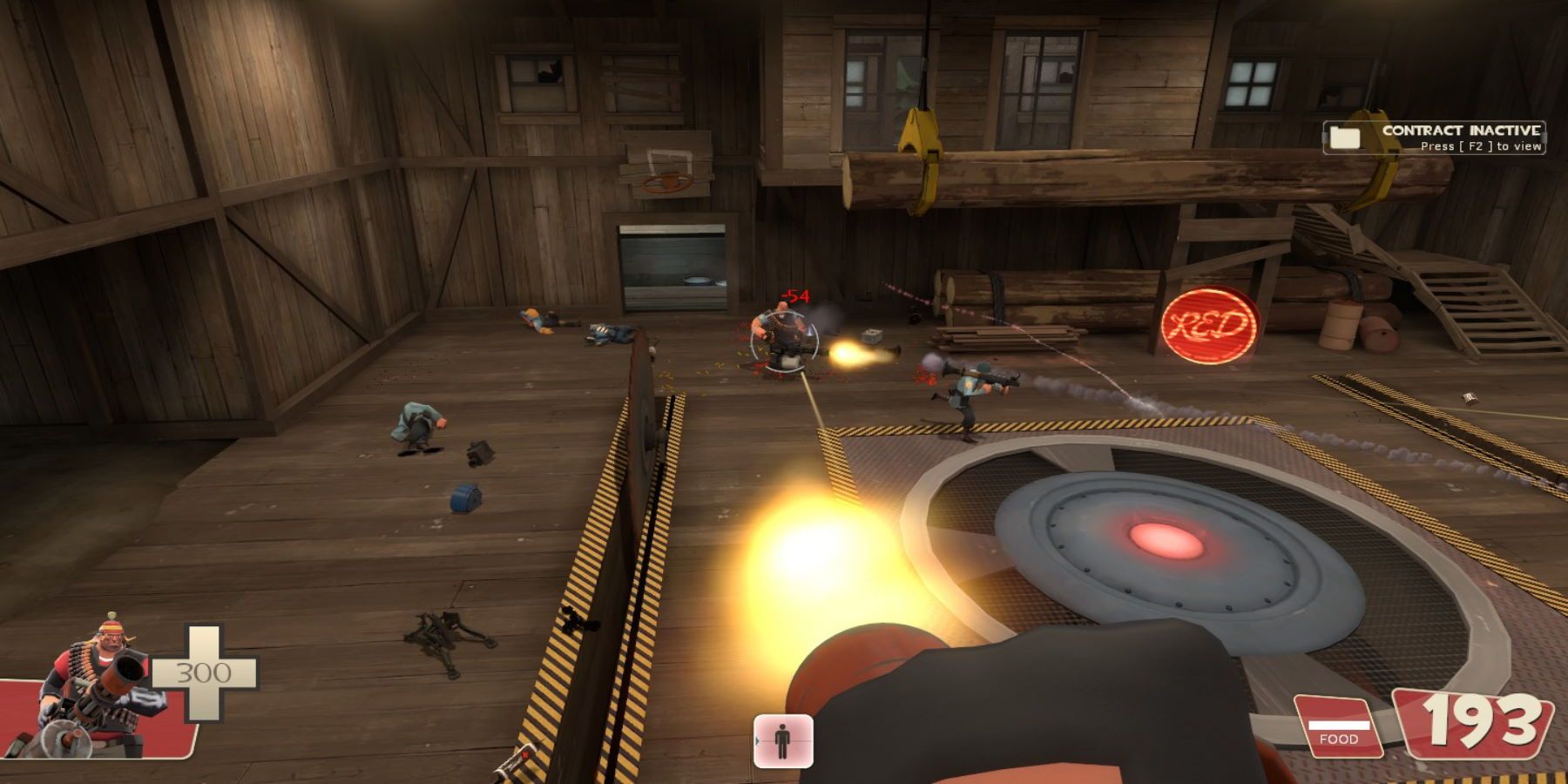 A Heavy Weapons Guy firing at another Heavy with a minigun near a RED-controlled point in a building made of wood. A BLU soldier is nearby, along with metal and a few dead enemies