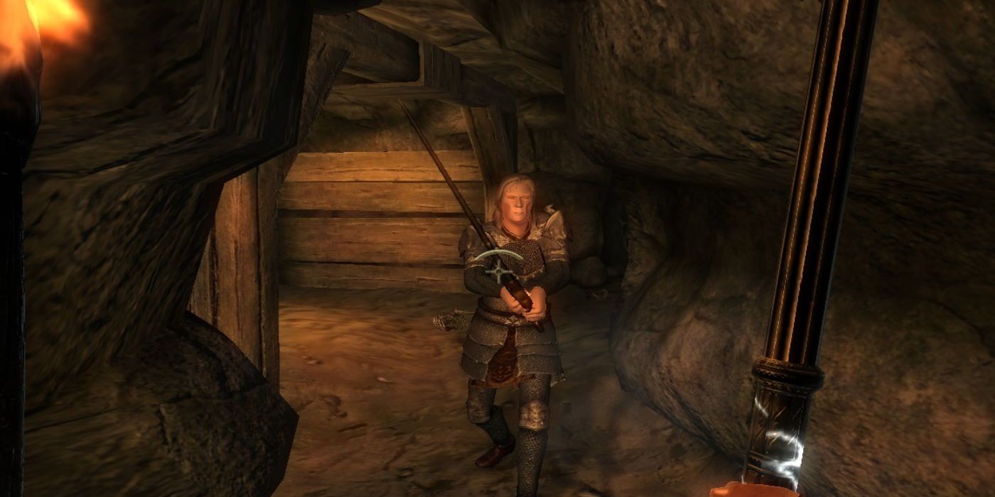 The player approaching an attacking vampire in a cave