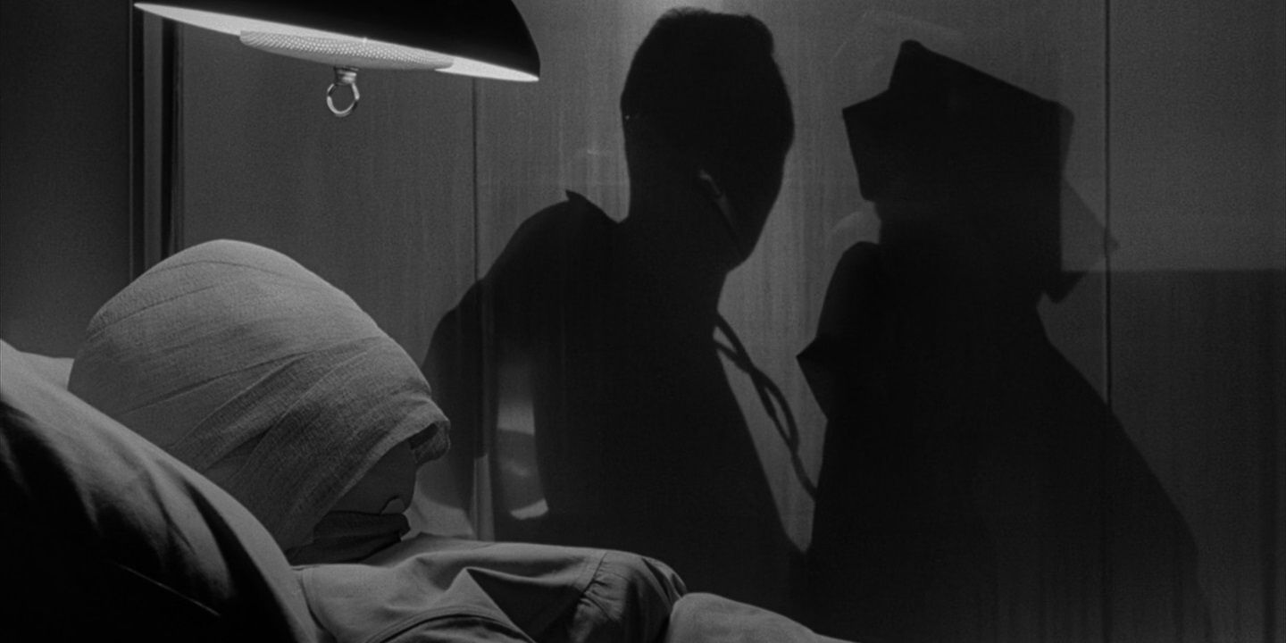 A bandaged woman lies in bed in The Twilight Zone's "Eye of the Beholder".